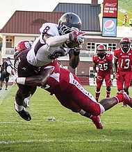 Virginia Union University running back William Stanback is tackled during last Saturday’s game against Winston-Salem State University. Stanback had three touchdowns in the Panthers’ 37-14 victory over the CIAA champions.