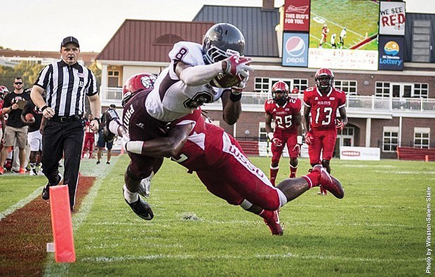 Virginia Union University running back William Stanback is tackled during last Saturday’s game against Winston-Salem State University. Stanback had three touchdowns in the Panthers’ 37-14 victory over the CIAA champions.