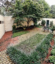 The new Valentine-Jackson Memorial Garden enshrines the memories and letters of the Valentine and Jackson families, enslaved people who were brought to the Virginia Executive Mansion in 1837 by Gov. David Campbell of Abingdon. The garden sits outside the mansion’s old slave quarters that were renovated in 1999 and now serve as guest bedrooms. Plaques around the garden wall contain excerpts from the letters.