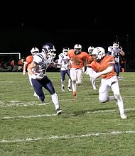 Plainfield South wide receiver Tom Macari (3) with a long reception which help set up the Cougarsβ first touchdown in his teamβs 17-3 win over Plainfield East.