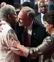 
Vice presidential nominee Tim Kaine, center, and his wife, former Virginia Secretary of Education Anne Holton, are congratulated by former state Sen. Henry L. Marsh III of Richmond after Tuesday’s debate in Farmville. Mr. Marsh was among Sen. Kaine’s special guests at the nationally televised event at Longwood University.