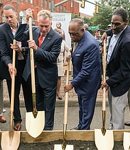 This group proudly prepares to turn the ground Sept. 29 to officially launch development of the Downtown plaza where a statue to Richmond pioneering businesswoman Maggie L. Walker will stand. Wielding the shovels are, from left: J. Maurice Hopkins of the Mag- gie Walker High School Class of 1965; City Councilman Chris A. Hilbert; Mrs. Walker’s great-great-grandson, Diallo Brooks of Washington; Gov. Terry McAuliffe; Mayor Dwight C. Jones; Mrs. Walker’s great-grandson, Johnny Mickens III of Richmond; Melvin Jones Jr., who helped spearhead the statue effort; and Selena Cuffee-Glenn, Richmond’s chief administrative officer. Location: Broad and Adams streets. The city is investing nearly $1 million to create the statue and plaza to honor Mrs. Walker, who, in 1903, became the first African-American woman to found and head a bank in the United States.