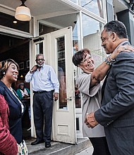 Richmond City Council Vice President Ellen F. Robertson embraces civil rights icon the Rev. Jesse Jackson outside of Croaker’s Spot on Hull Street in South Side. Ms. Robertson, Richmond Delegate Jennifer L. McClellan, left, and Petersburg Delegate Lashrecse D. Aird were among the group that dined and talked politics with Rev. Jackson on Tuesday as he campaigned in Richmond for Democratic presidential candidate Hillary Clinton. Croaker’s Spot general manager Ralph Fields looks on. 
