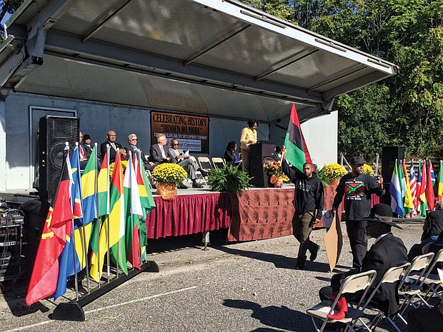 Delegate Delores L. McQuinn, chair of the Richmond Slave Trail Commission, addresses the audience at Monday’s development ceremony at the Lumpkin’s Jail site in Shockoe Bottom. Among those joining her on the stage were Richmond Mayor Dwight C. Jones, Gov. Terry McAuliffe, former Gov. Bob McDonnell, Congressman Robert C. “Bobby” Scott, City Council President Michelle Mosby and Dr. Joseph F. Johnson, interim president of Virginia Union University. 