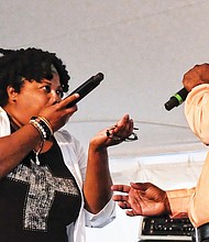 Paris Nicole and her father, Ed Cage, beatbox during their performance Sunday. Right, 