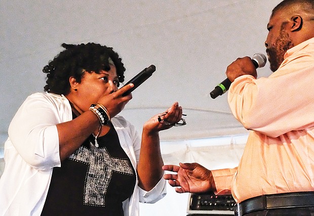 Paris Nicole and her father, Ed Cage, beatbox during their performance Sunday. Right, 