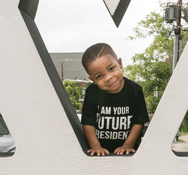 
Planning ahead//
Tayshawn Williams has his eye on the future. The youngster was spotted wearing his message at the recent 2nd Street Festival in Jackson Ward.