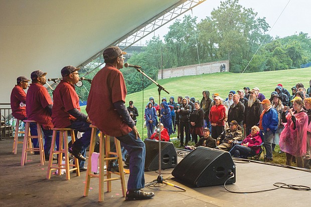 Music, music, music //  The Fairfield Four gospel group croons to the small crowd that braved the rain Saturday.