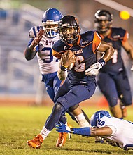 Quarterback Tarian Ayres runs the ball in to score for the Virginia State University Trojans during last Friday’s home game against Elizabeth City State University. The game was played a day early because of weather concerns.