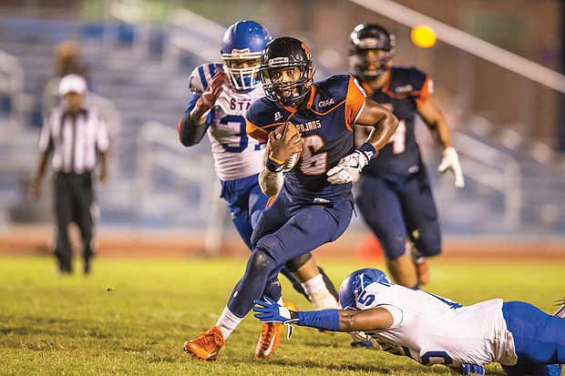 Quarterback Tarian Ayres runs the ball in to score for the Virginia State University Trojans during last Friday’s home game against Elizabeth City State University. The game was played a day early because of weather concerns.