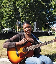 Guitarist Lamayah Collier waits her turn to perform.
Sponsors included many of the area’s businesses and gather- ing spots, including Dogtown Dance Theater, Brewer’s Café, Bits n Bytes, Brand New Wave Barbershop, Girl Scout Troop 5237 and the Hull Street Public Library.