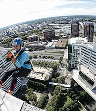 Sandra Sellars/Richmond Free Press //

Tracy Sears, a local CBS news anchor, prepares to rappel 25 stories to the ground during the “Over the Top” fundraiser for Special Olympics Virginia last Friday. Location: SunTrust Center, 919 E. Main St., in Downtown. Each person who took the plunge had to raise $1,000 to participate in the adventure. This was the eighth and final edition of this daredevil event. 