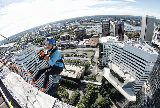 Sandra Sellars/Richmond Free Press //

Tracy Sears, a local CBS news anchor, prepares to rappel 25 stories to the ground during the “Over the Top” fundraiser for Special Olympics Virginia last Friday. Location: SunTrust Center, 919 E. Main St., in Downtown. Each person who took the plunge had to raise $1,000 to participate in the adventure. This was the eighth and final edition of this daredevil event. 