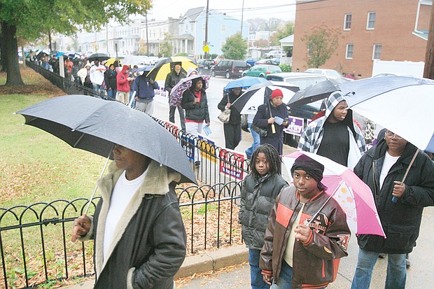 This file photo shows the importance of voting to people throughout Richmond. Voters stand in a long line outside Carver Elementary School to cast ballots in the November 2008 presidential election.