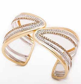  A bold geometric cut bracelet with champagne diamonds is an ideal holiday gift.