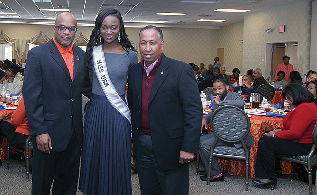 
Virginia State University President Makola M. Abdullah, left, greets university alumni Deshauna Barber, Miss USA 2016, and retired Gen. Dennis L. Via, at a campus event last Friday.