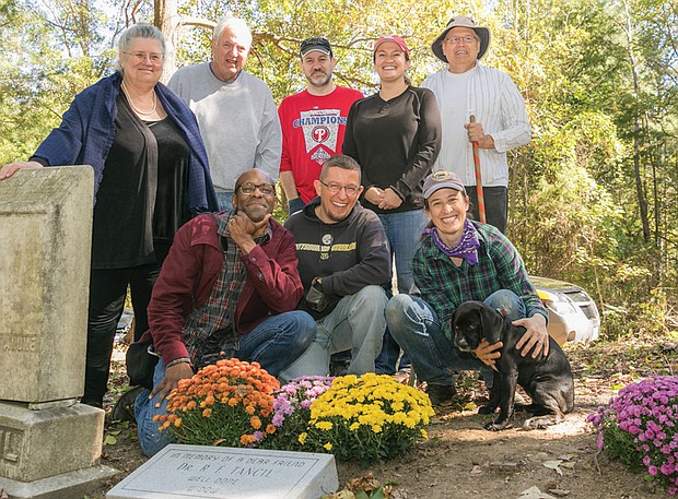 Honoring the past //
When the headstone of a prominent Richmond physician born into slavery around 1852 was taken last year from historic East End Cemetery, his descendants and other volunteers raised money to purchase a new headstone.
The new marker for Dr. Richard F. Tancil was dedicated Oct. 22 during a short ceremony at the cemetery to honor the remarkable man who graduated from Howard University’s medical school and set up a practice in Church Hill. He also started the Nickel Savings Bank in 1896, and operated it out of his East End home.
Instrumental in replacing the grave marker are, standing from left, Dr. Tancil’s great-granddaughter-in-law, Susan Mitchell; John Shuck, coordinator of cleanup and restoration efforts at East End Cemetery; Jess Kilgore, Melissa Pocock and Bruce Tarr. Also, kneeling from left, Brian Palmer, Justin Curtis and Erin Palmer.
East End Cemetery, established around 1897, is the final resting place for more than 13,000 people, including pioneering educator and civic leader Rosa D. Bowser; Hezekiah F. Jonathan, vice president of Mechanics Savings Bank; and William Custalo, longtime proprietor of the Custalo House bar and restaurant on Broad Street.	 
