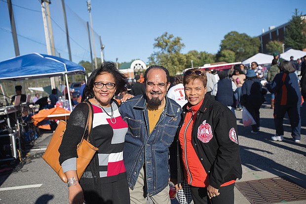 From left, Bobette Banks, Alfred Harris and Vicki Grant enjoy the food and fellowship at last Saturday’s homecoming tailgate.