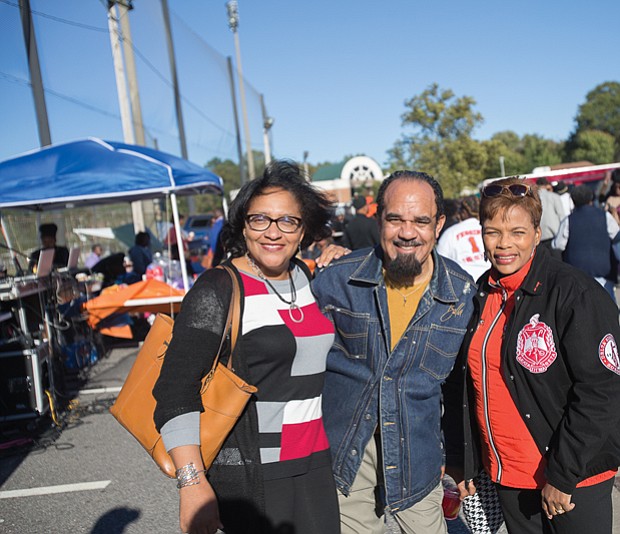 From left, Bobette Banks, Alfred Harris and Vicki Grant enjoy the food and fellowship at last Saturday’s homecoming tailgate.
