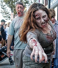 Zombies ‘attack’ Carytown //The sight of dozens of people dressed and made up to zombie perfection caused shoppers, restaurant- goers and spectators to pull out their cell phones, snap
photos and shoot videos.