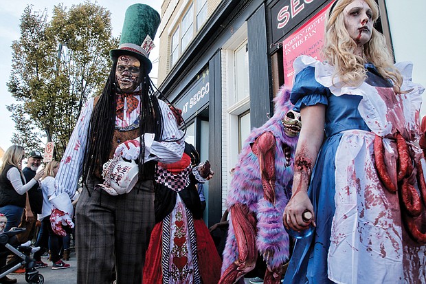 The zombies silently limped and paraded their way
west on Cary Street to Nansemond Street, where they made a U-turn and headed east on Cary Street to their final resting place, The Byrd Theatre. The Zombie Walk raises hundreds of dollars for charity each year.