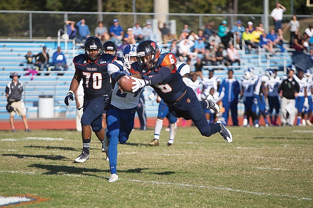 Virginia State University quarterback Tarian Ayres escapes the Chowan University defense to run 19 yards and dive for a touchdown in the third quarter of last Saturday’s game at Rogers Stadium in Ettrick. VSU won 49-21.