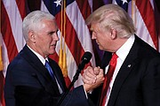 President-elect Donald Trump, right, thanks his vice presidential running mate, Gov. Mike Pence of Indiana, during their Election Night rally in New York that went into Wednesday morning. 
