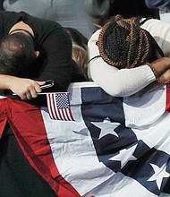 
Supporters of Hillary Clinton react early Wednesday morning as results of the presidential election come in. Thousands of supporters attended the rally for Mrs. Clinton in New York expecting a different outcome in the presidential race. 