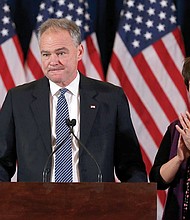 Democratic vice presidential nominee Tim Kaine and his wife, former Virginia Secretary of Education Anne Holton, bolster the crowd Wednesday before Hillary Clinton’s presidential concession speech. 