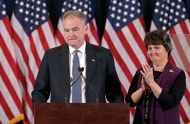 Democratic vice presidential nominee Tim Kaine and his wife, former Virginia Secretary of Education Anne Holton, bolster the crowd Wednesday before Hillary Clinton’s presidential concession speech. 