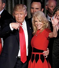 President-elect Donald Trump hugs his campaign manager, Kellyanne Conway, while he greets staff and supporters after claiming victory early Wednesday. Mr. Trump won key swing states, including Ohio and Pennsylvania. 