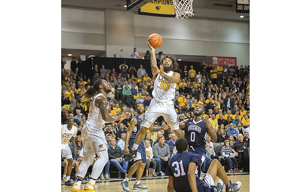 James Haskins/Richmond Free Press

VCU guard Jonathan Williams of Richmond goes up and over the heads of players from Queens University during an exhibition game last Friday at the Siegel Center in Richmond.