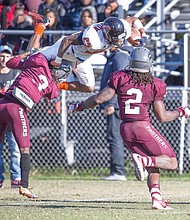 Virginia State University running back Trenton Cannon goes airborne with the ball for a big gain last Saturday against Virginia Union University at Hovey Field in Richmond.
