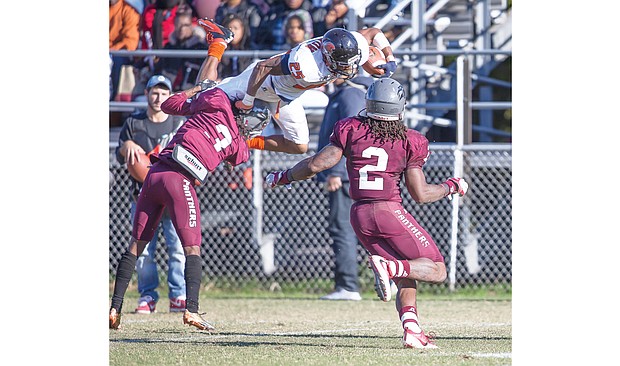 Virginia State University running back Trenton Cannon goes airborne with the ball for a big gain last Saturday against Virginia Union University at Hovey Field in Richmond.