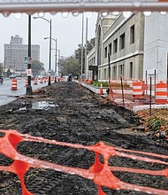 Sandra Sellars/Richmond Free Press
The first of 14 stations for GRTC’s Bus Rapid Transit is under construction. 
Work began last week on the station located on the north side of the 2200 block of West Broad Street between Allison and Strawberry streets, officials said. The work has closed the westbound curb lane on Broad Street in that area. 
Separately, the work to relocate utilities continues along the south side of Broad Street and along East Main Street to make way for additional transit stations.
About $65 million is being poured into developing the speedier bus line — dubbed The Pulse — that will run 7.6 miles between Rocketts Landing in the east to The Shops at Willow Lawn in the west. 
The city is contributing $7.6 million and Henrico County $400,000. The federal government is providing $25 million, with the state contributing the remaining $32 million. 
The Pulse is expected to be in operation next October, officials have said.