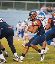 Virginia State University running back Trenton Cannon carries the ball, helping the Trojans to a 45-35 victory over Tuskegee University last Saturday in Alabama.