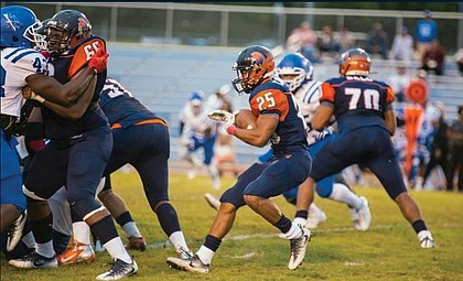 Virginia State University running back Trenton Cannon carries the ball, helping the Trojans to a 45-35 victory over Tuskegee University last Saturday in Alabama.