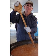 Soups on // The 17th Street Farmers’ Market in Shockoe Bottom became a wonderful kitchen on Nov. 5 as Meredith Minter of Highland Springs, left, and other cooks stirred and served enormous vats of brunswick stew. 