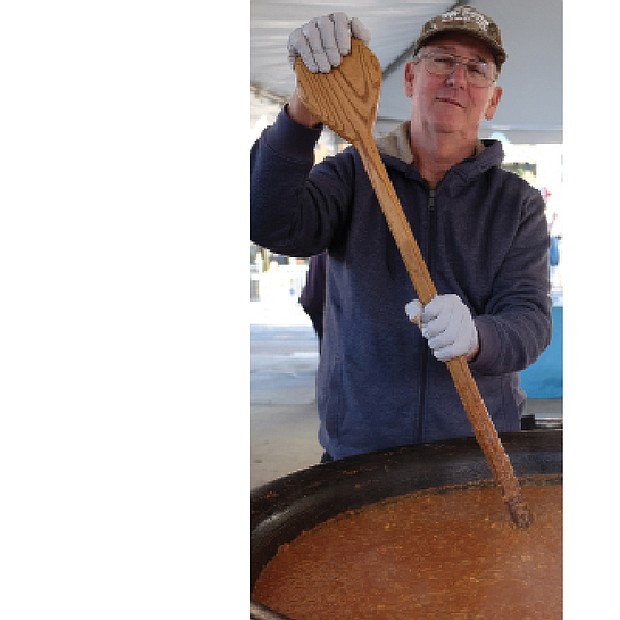 Soups on // The 17th Street Farmers’ Market in Shockoe Bottom became a wonderful kitchen on Nov. 5 as Meredith Minter of Highland Springs, left, and other cooks stirred and served enormous vats of brunswick stew. 