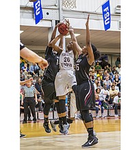 Lady Walker, wearing No. 20, goes up for a score during Virginia Union University’s Lady Panthers 91-72 victory over Indiana University of Pennsylvania in the NCAA Division II tournament March 11, 2016, at Barco-Stevens Hall. 