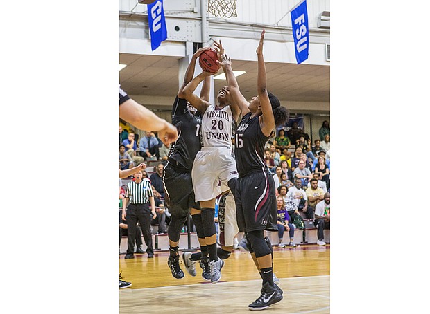 Lady Walker, wearing No. 20, goes up for a score during Virginia Union University’s Lady Panthers 91-72 victory over Indiana University of Pennsylvania in the NCAA Division II tournament March 11, 2016, at Barco-Stevens Hall. 