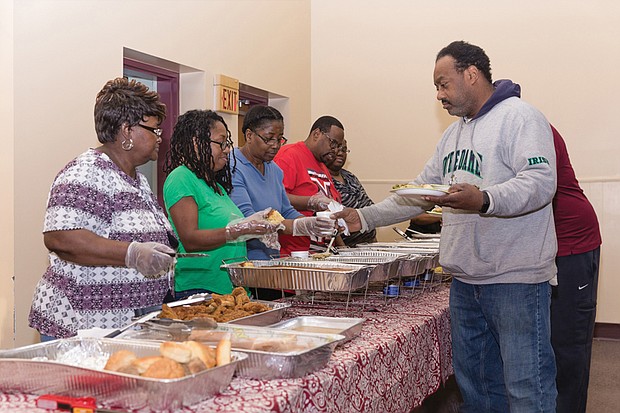 A pre-Thanksgiving blessing //

Thanksgiving arrived early when the Richmond Christian Center extended “A Thanksgiving Meal” to the less fortunate in the community last Saturday. The pre- Thanksgiving event featured all the delicious dishes of the season, with volunteers from the South Richmond church serving their guests. From left, servers Rose Austin, Benita Johnson, Sharon Owen, the Rev. Shawn Scott and Mary Scott offer helpings to Gregory Stallworth.