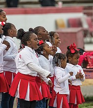 Cheering for the boys // 
Battery Park’s cheerleaders let out an enthusiastic cheer during last Saturday’s Richmond Department of Parks, Recreation and Community Facilities’ Youth Football Championships at City Stadium, where teams from 16 community centers vied for top honors. Story, another photo, B6. 
