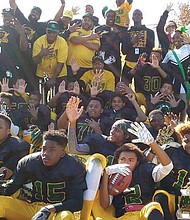 Southside Ducks team members and supporters hold up five fingers signifying their fifth consecutive championship Nov. 19 in the Richmond Department of Parks, Recreation and Community Facilities’ Youth Football Championships at City Stadium.