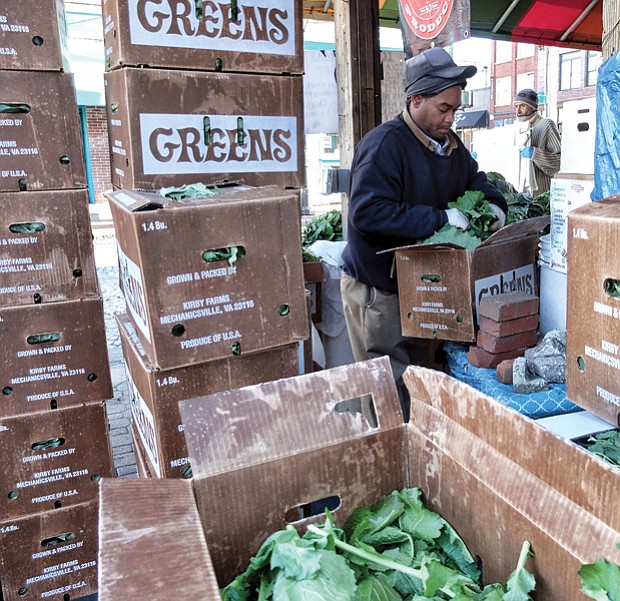 Timothy Christian sorts through a box of fresh leafy greens as he prepares for holiday shoppers at the 17th Street Farmers’ Market in Shockoe Bottom. Similar markets have sprouted in the Richmond area, but this market is the oldest. It has been a public gathering place since 1737, five years before Richmond was incorporated as a town. The site was designated as a “public market” in 1779, just a year before Richmond was officially named the state capital and three years before Richmond was designated an independent city. The city is to give the market area a facelift to create a more European-style plaza. 