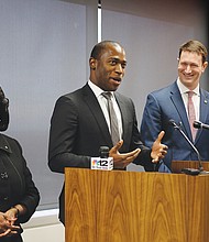 Mayor-elect Levar Stoney, center, introduces his picks for top posts during a news conference Monday. Selena Cuffee-Glenn will continue as Richmond’s chief administrative officer, while J.E. Lincoln Saunders will serve as Mr. Stoney’s chief of staff.