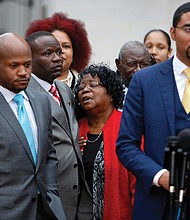 Judy Scott, center, is comforted by her son, Rodney Scott, as family attorneys Chris Stewart, left, and Justin Bamberg, right, hold a news conference Monday after a mistrial was declared in the case involving the shooting death of Mrs. Scott’s son, Walter Scott, last year in North Charleston, S.C. A videotape of the death shows Mr. Scott, 50, was shot in the back by former Patrolman Michael Slager. A mistrial was declared after the jury deadlocked. 