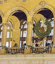 Spectators break into applause as the 46-foot Christmas tree at the James Center lights up with the city skyline and the Richmond Boys Choir serenades the crowd. Below, giant wreaths and yards of garlands adorn Main Street Station in Shockoe Bottom, where people enjoyed music, food trucks and a free movie last Friday night.
