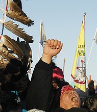 Native American “water protectors” celebrate last Sunday’s decision by the Army Corps of Engineers stopping the easement for the $3.8 billion Dakota Access pipeline next to the Standing Rock Sioux Reservation near Cannon Ball, N.D. 