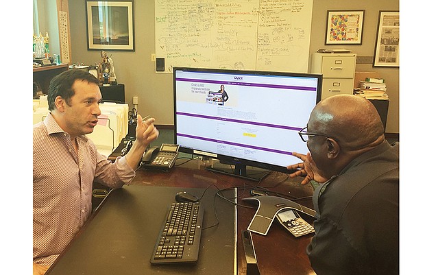 Allison Simoes
Don Vaccaro, left, and the Rev. Boise Kimber discuss Grace Church Websites, the project they launched to provide free websites for churches and nonprofit organizations.